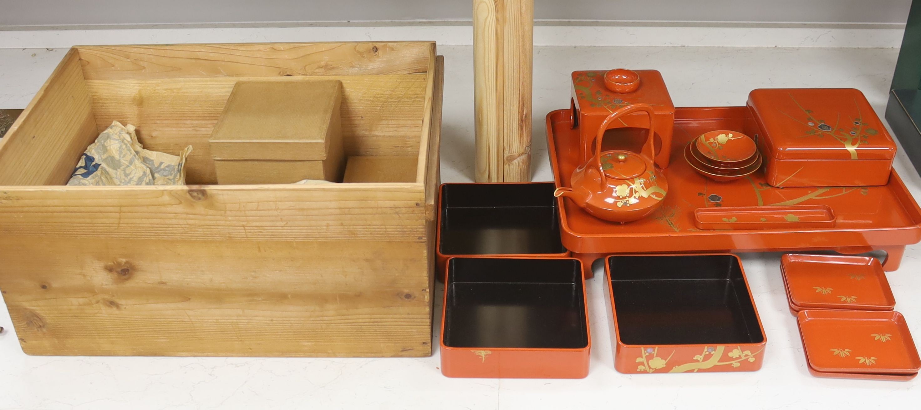 A Japanese red lacquer ceremonial sake set